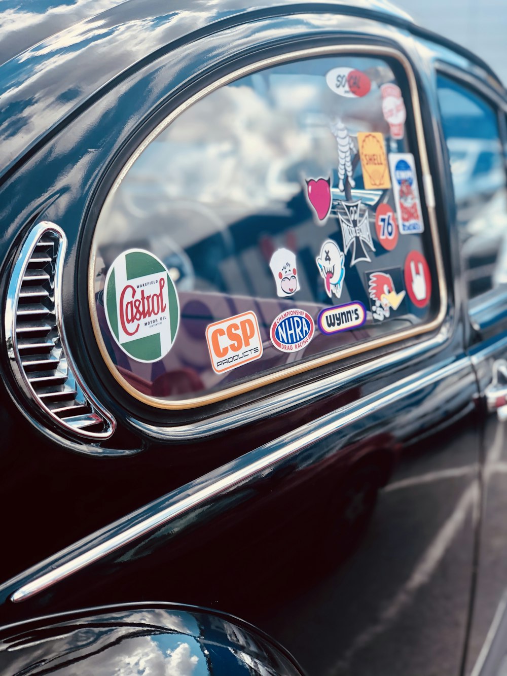 red and silver car with blue and white sticker