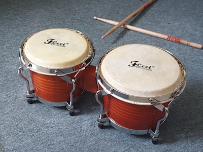 brown and white drum set drumstick google meet background