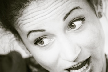 grayscale photo of womans face