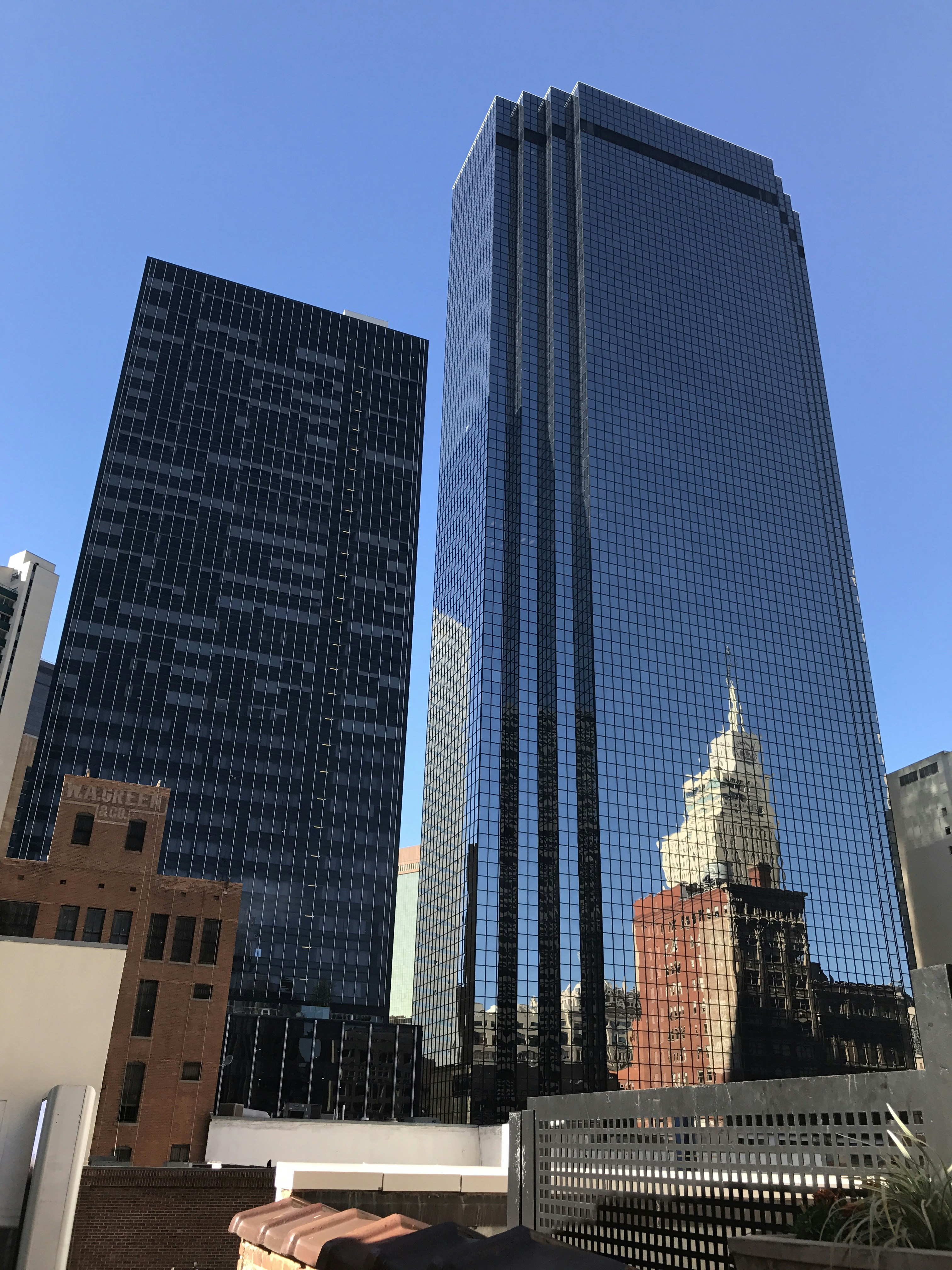 blue glass walled high rise building