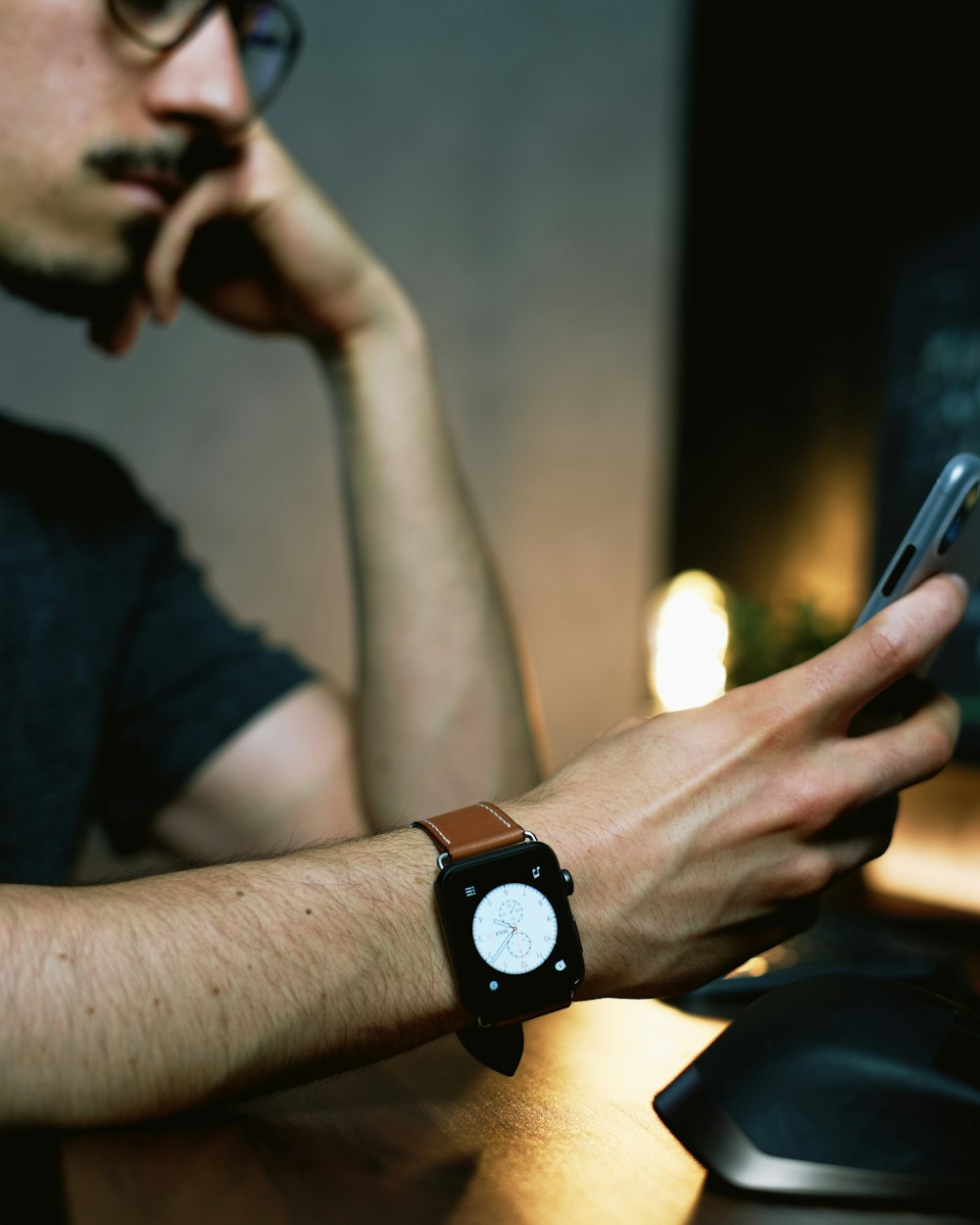 man in black shirt wearing black watch