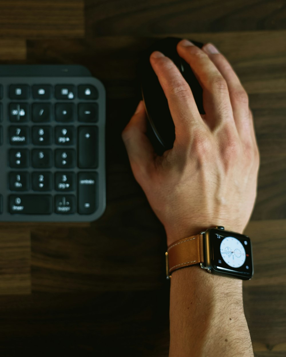 person wearing black and silver apple watch