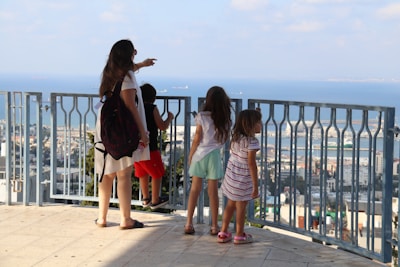 A family enjoying a balcony view.