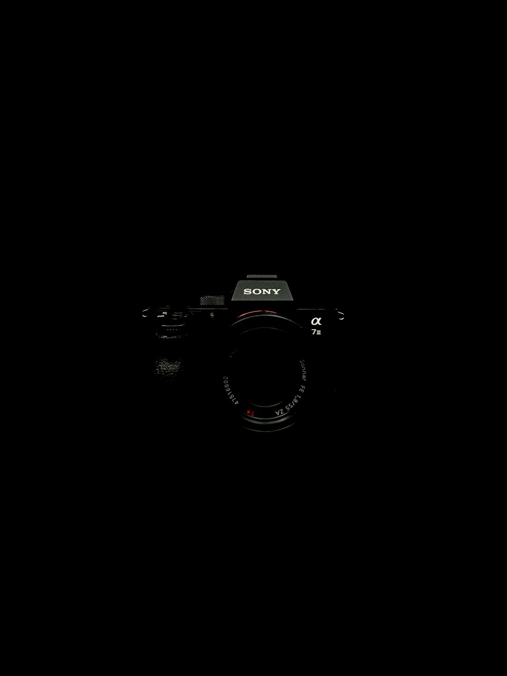 black nikon dslr camera on black surface