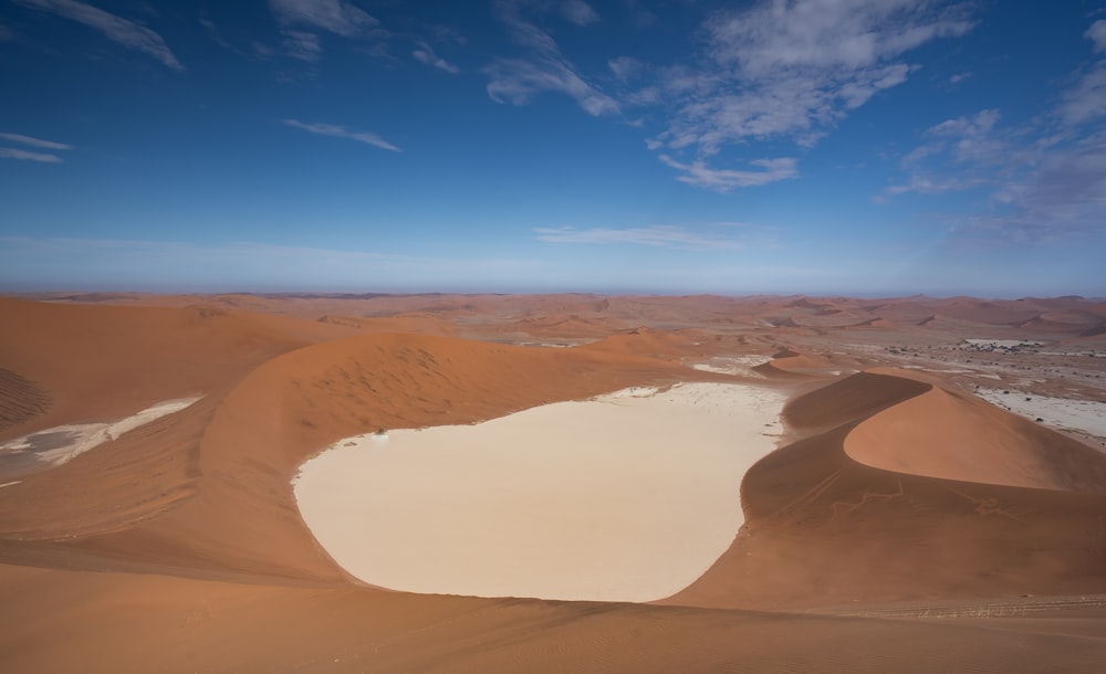 brown sand under blue sky during daytime