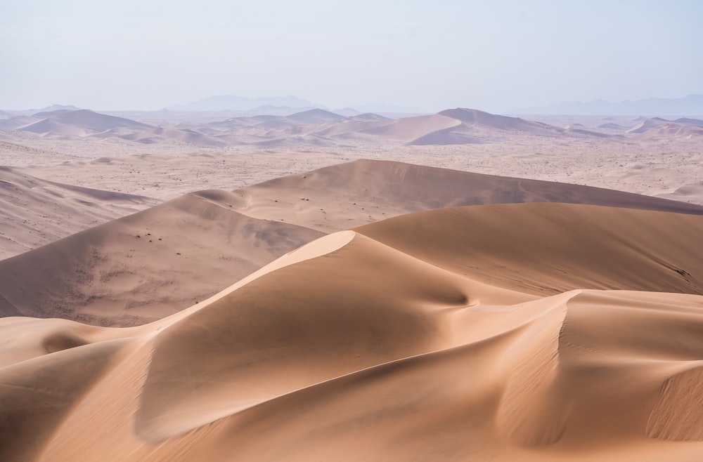 white sand under blue sky during daytime