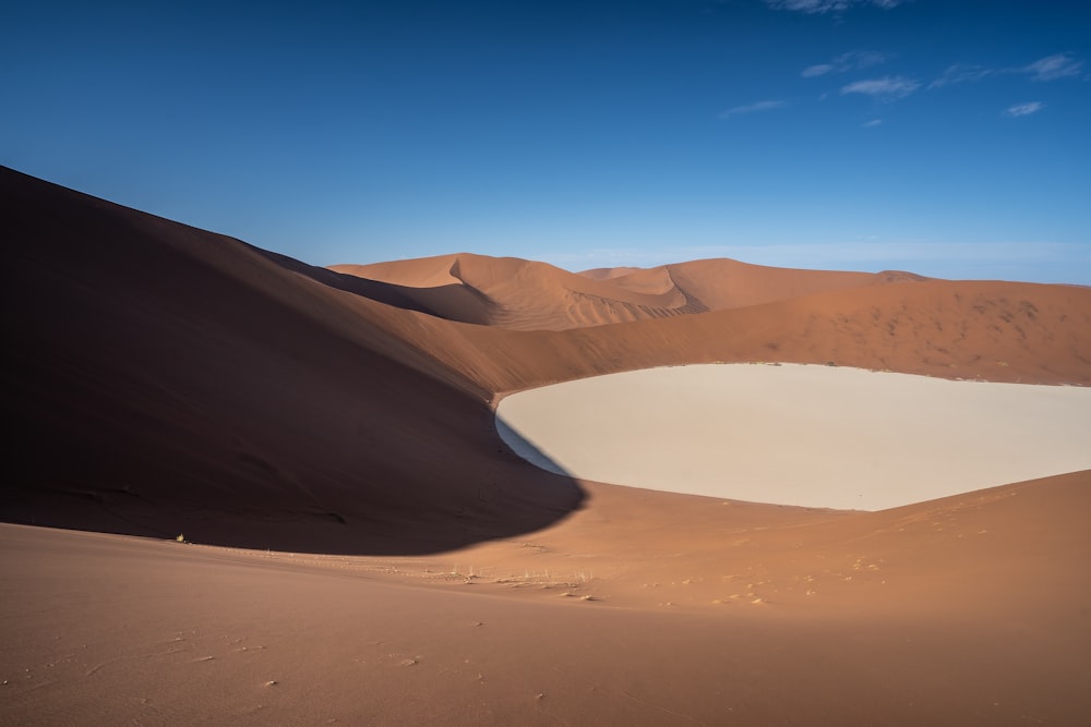 brown sand under blue sky during daytime