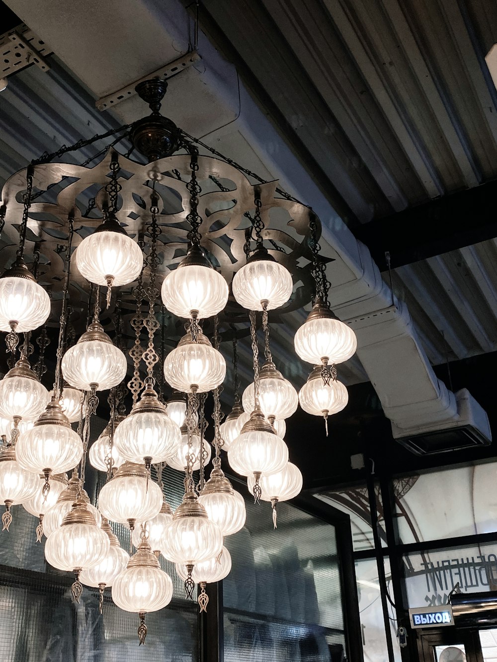 white pendant lamp turned on in room