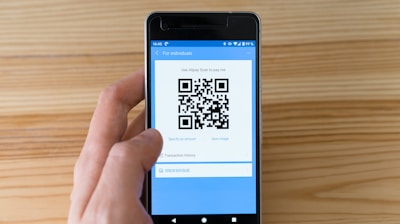 black android smartphone displaying qr code