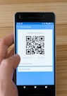 black android smartphone displaying qr code