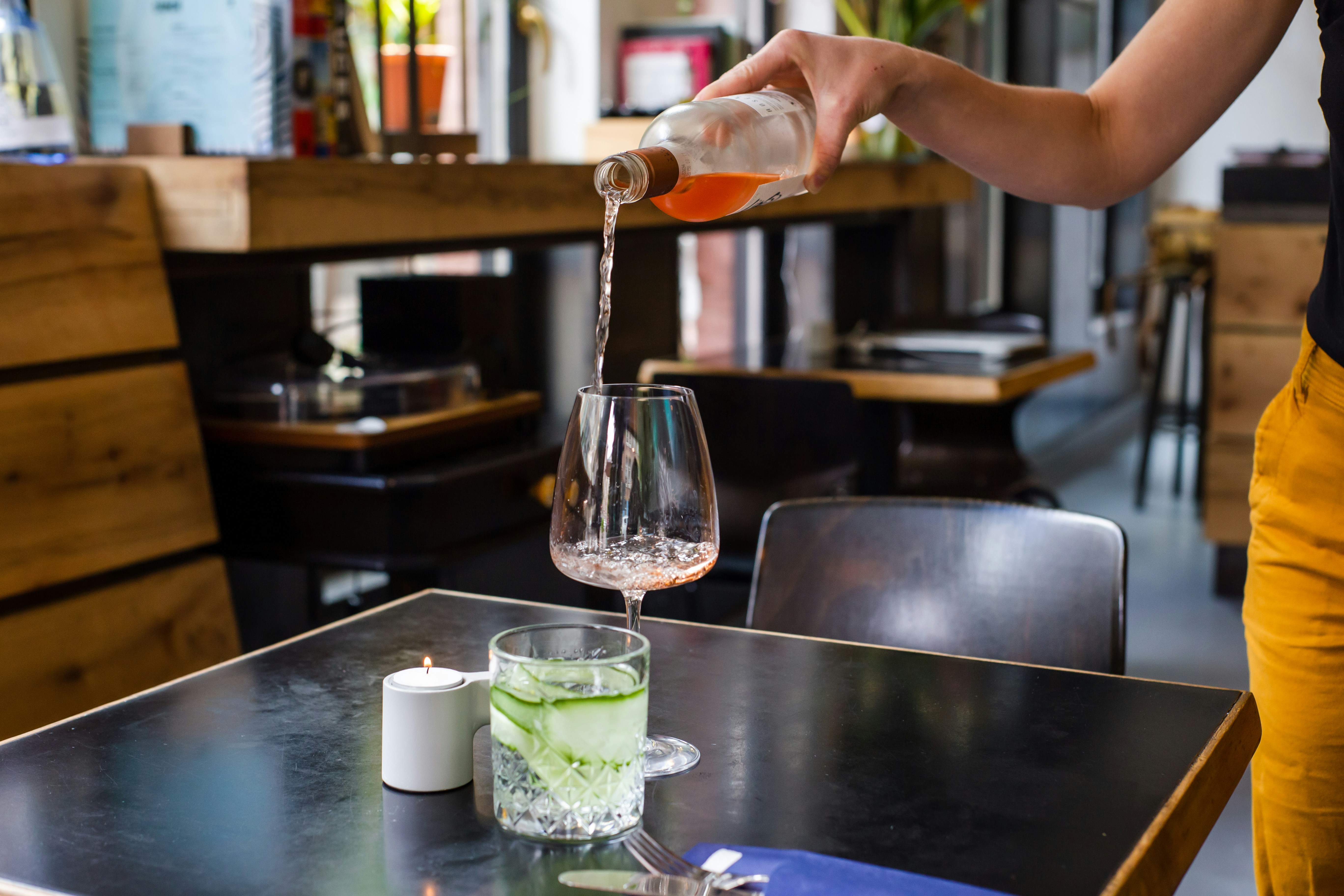 Pouring into wine glass on a table