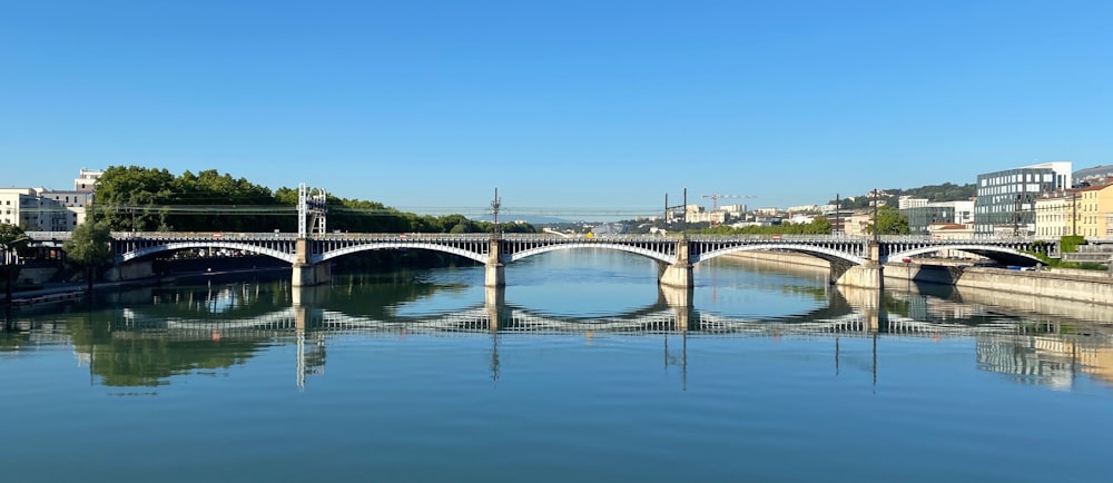 white concrete bridge over river during daytime