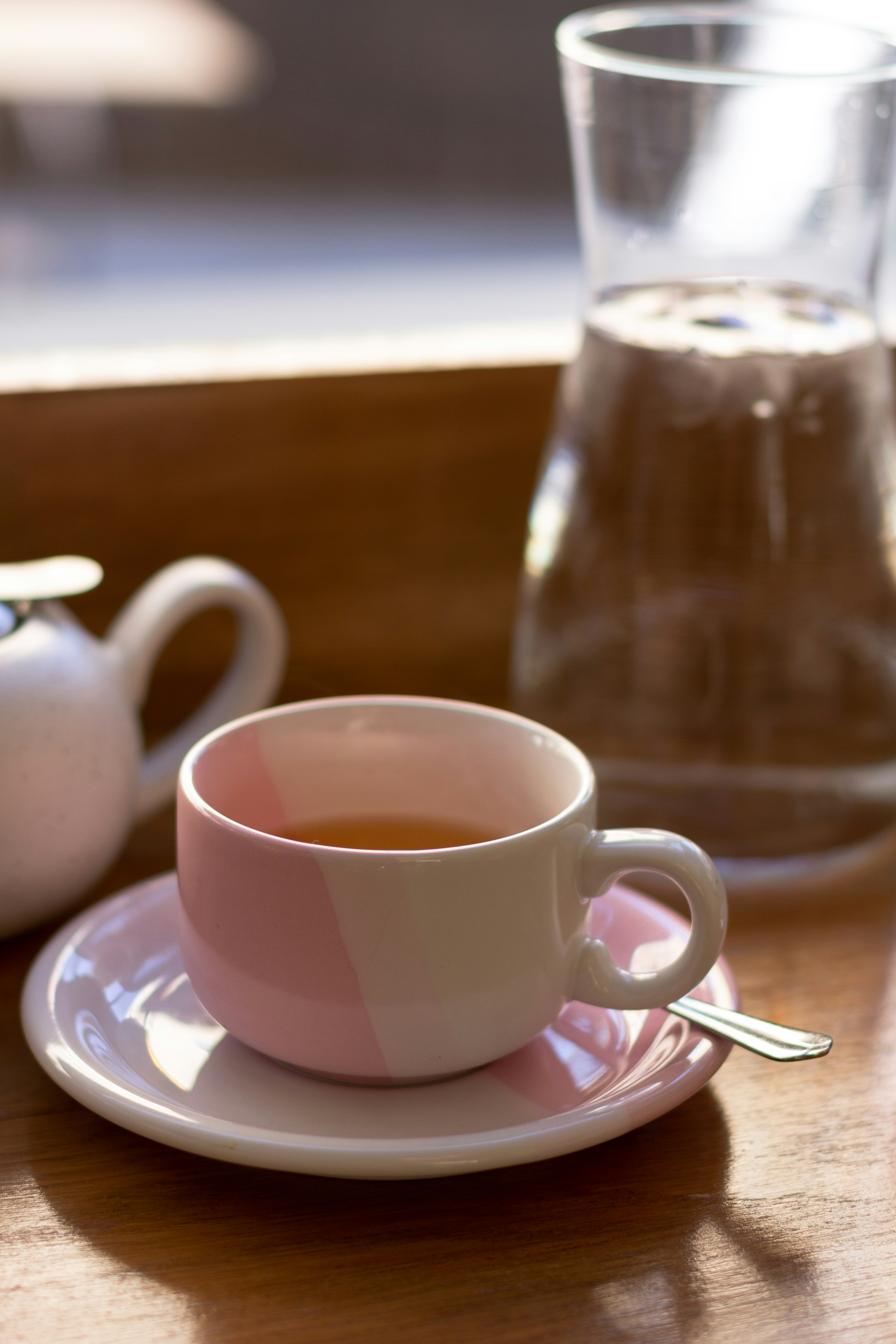 white ceramic mug on white ceramic saucer