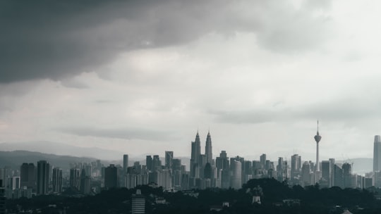 city skyline under white clouds during daytime in Kuala Lumpur City Centre Malaysia