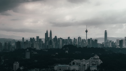city skyline under white clouds during daytime in Kuala Lumpur City Centre Malaysia