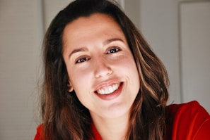 woman in red shirt smiling