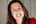woman in red shirt smiling
