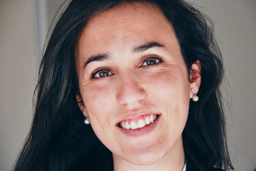 woman in black shirt smiling