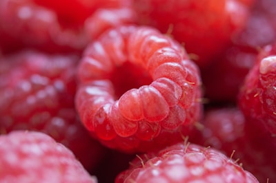 Close-up of fresh raspberries highlighting their vibrant red color and texture.