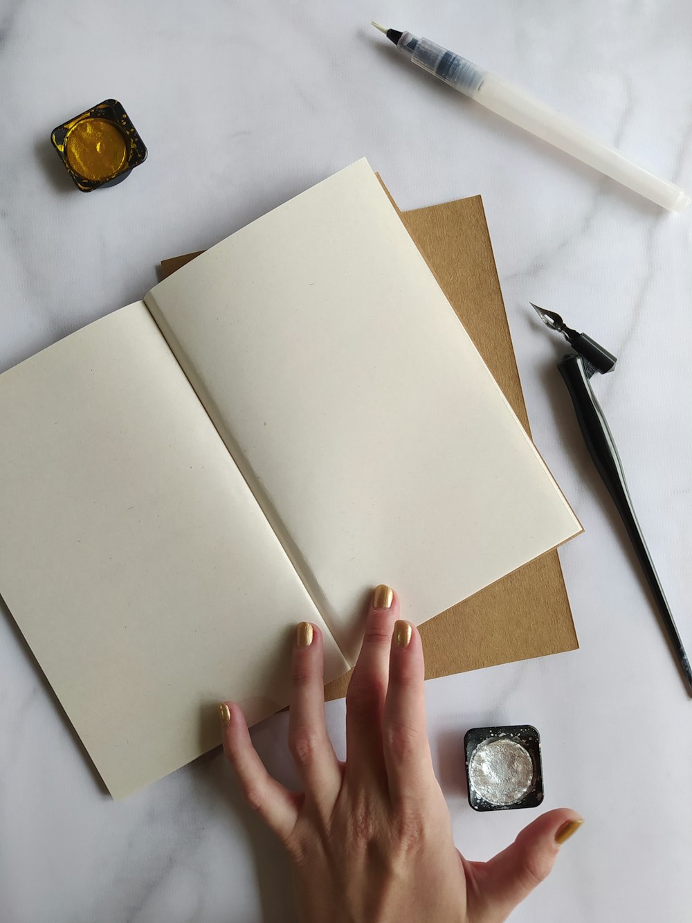 person holding white printer paper