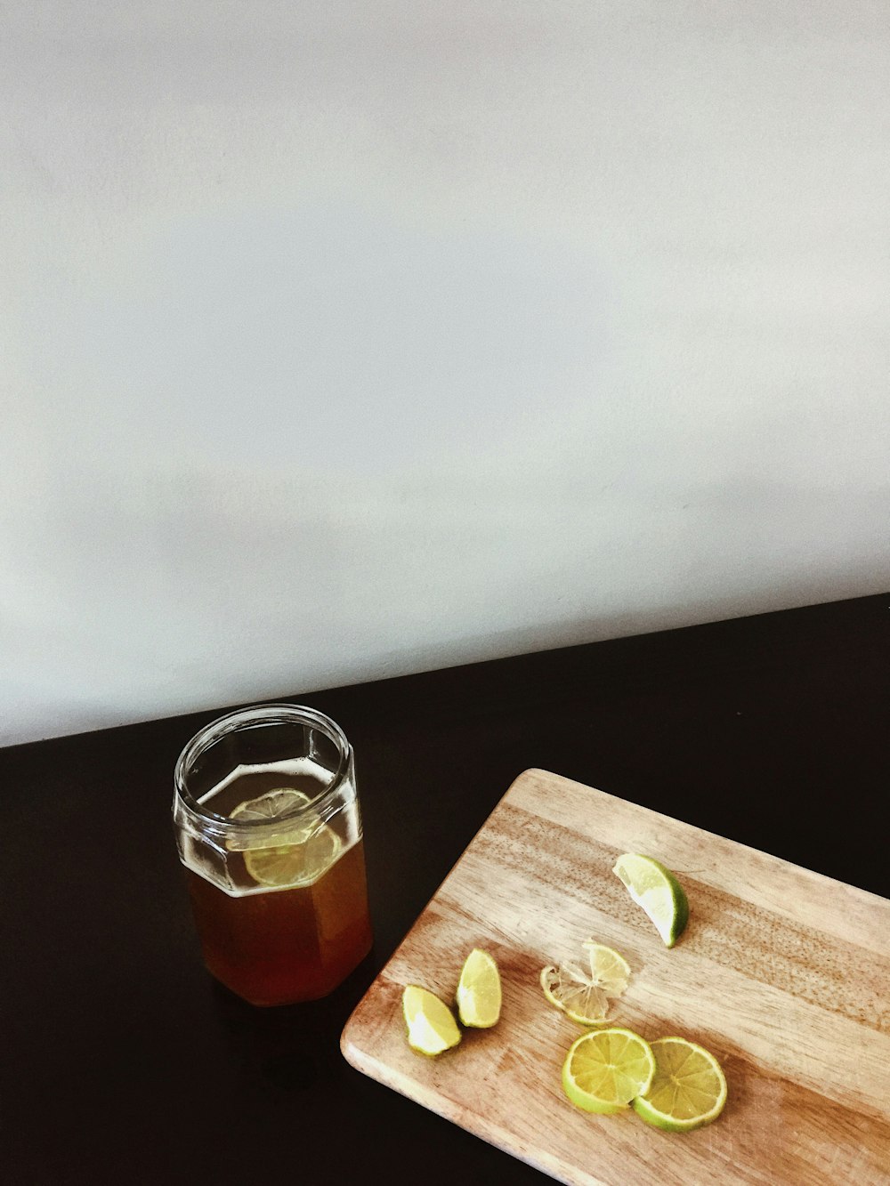 clear glass jar on brown wooden chopping board