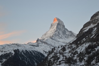 snow covered mountain during daytime