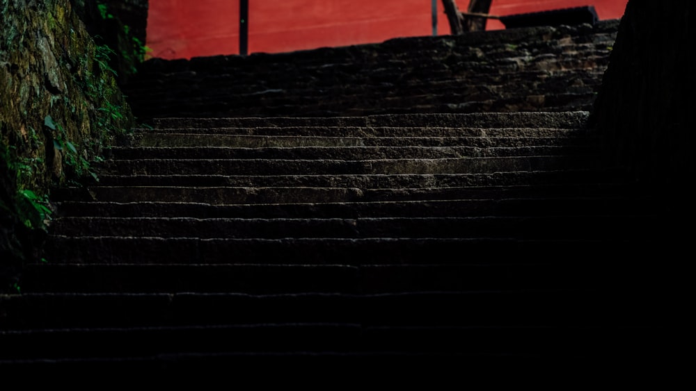 black concrete stairs with red wall