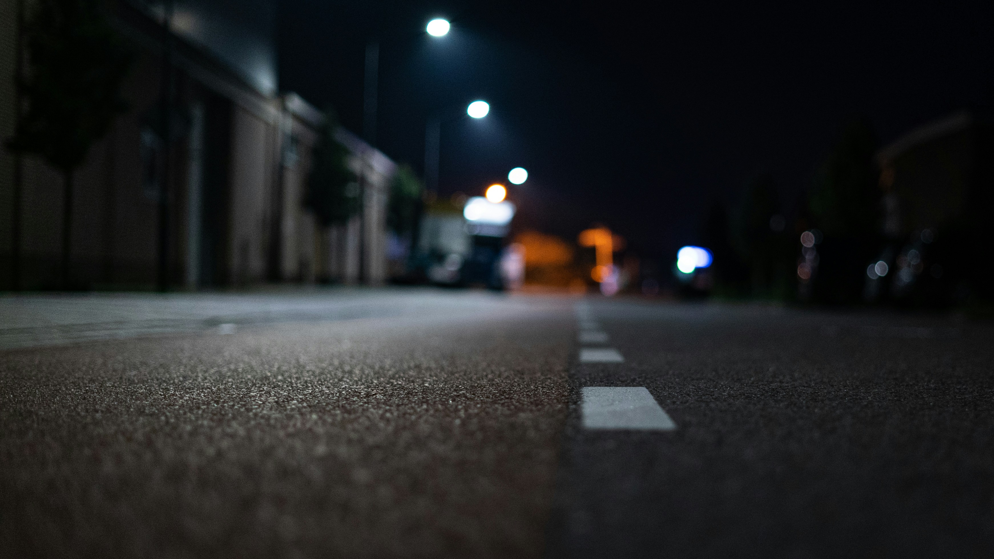 street at night with lamps overhead