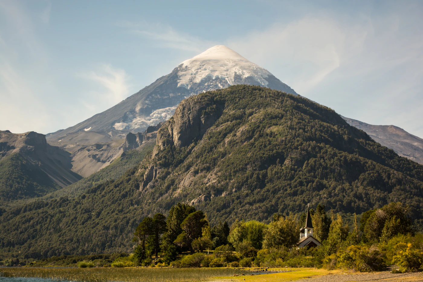 Couple in elopement attire at Torres del Paine in exceptional morning light with the granite towers and the glacial lake visible