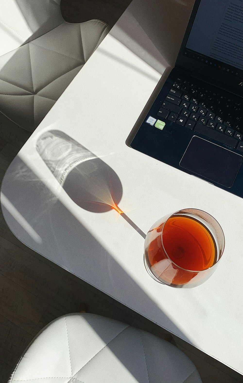 clear wine glass on white table