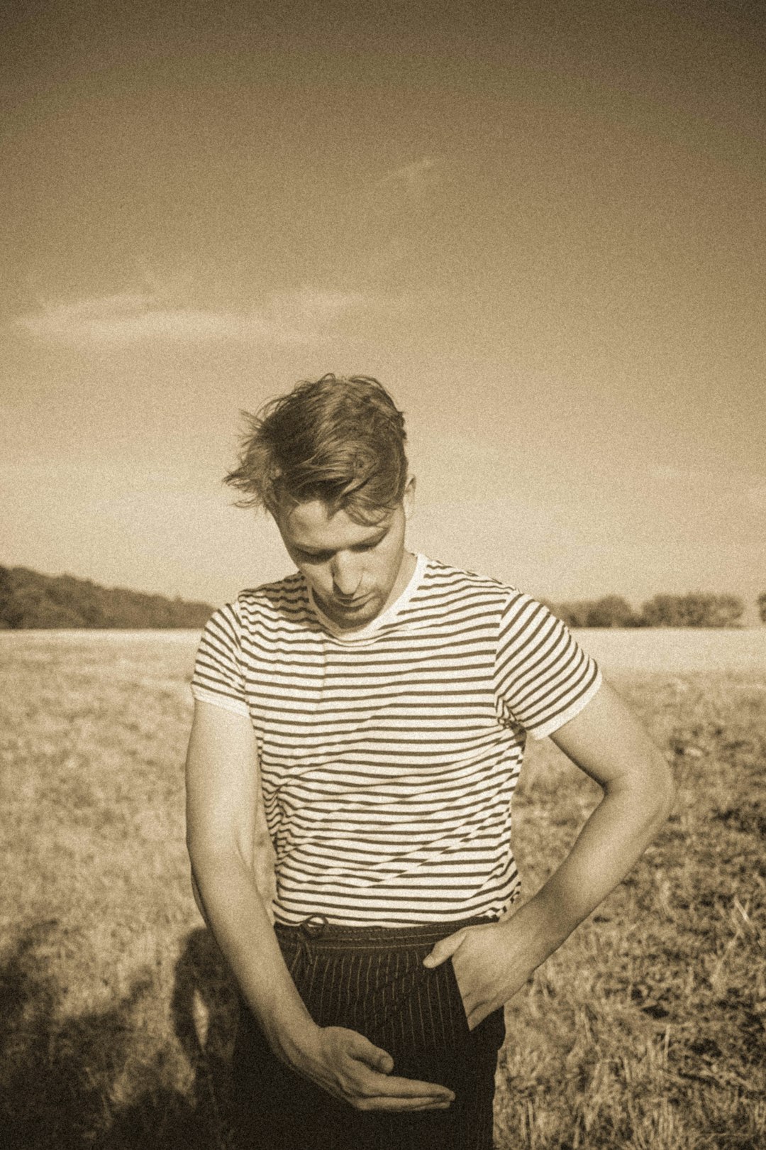 grayscale photo of woman in stripe shirt