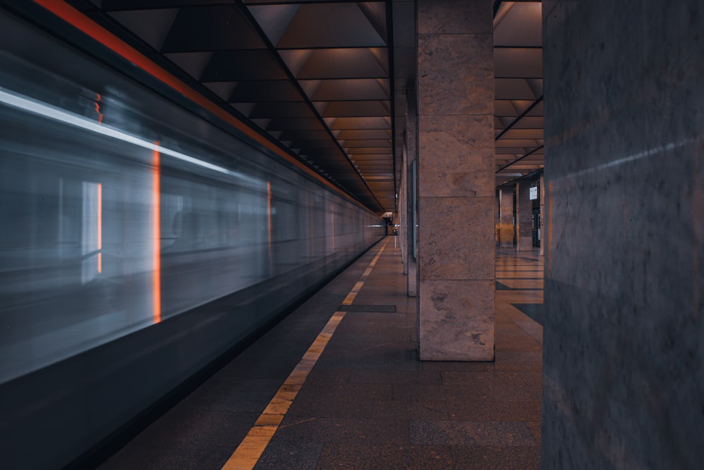 train station with lights turned on during night time