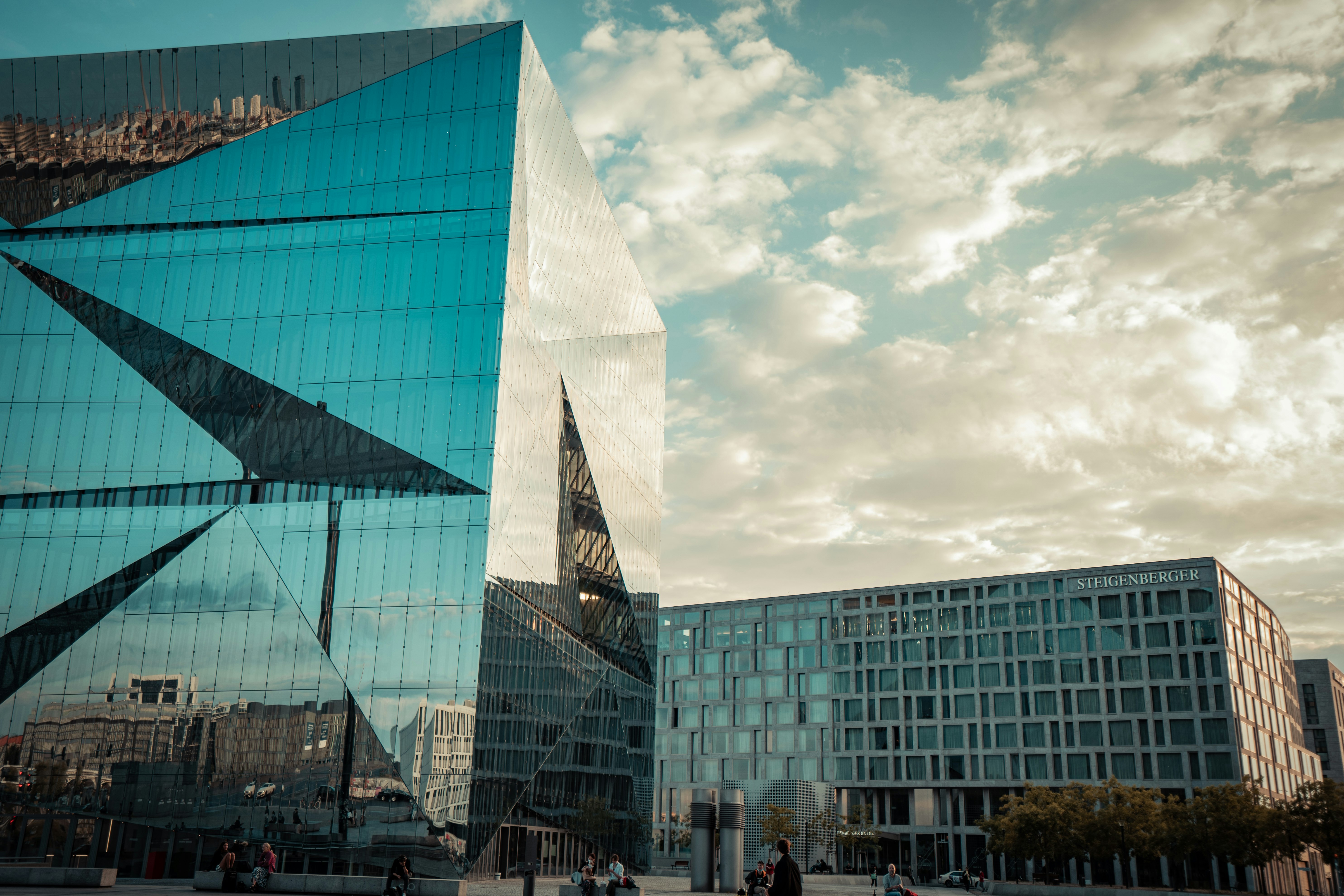 blue glass building under blue sky during daytime