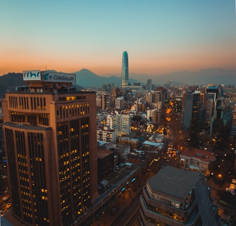 city with high rise buildings during night time