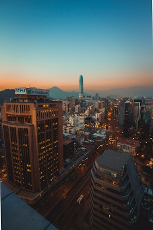 city with high rise buildings during night time