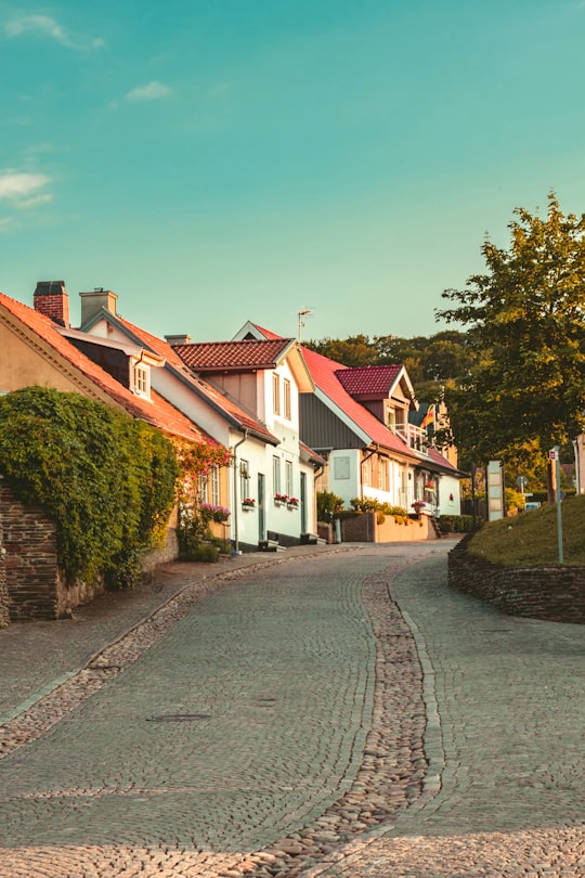 white and brown concrete house in Båstad Sweden