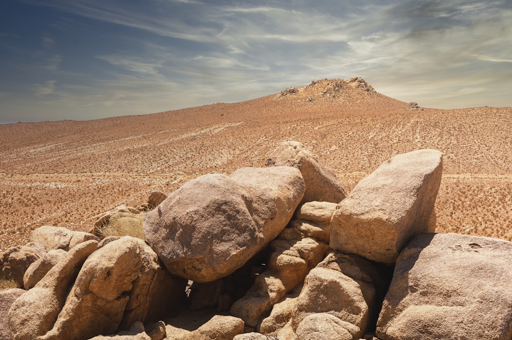 brown rocky mountain under blue sky during daytime