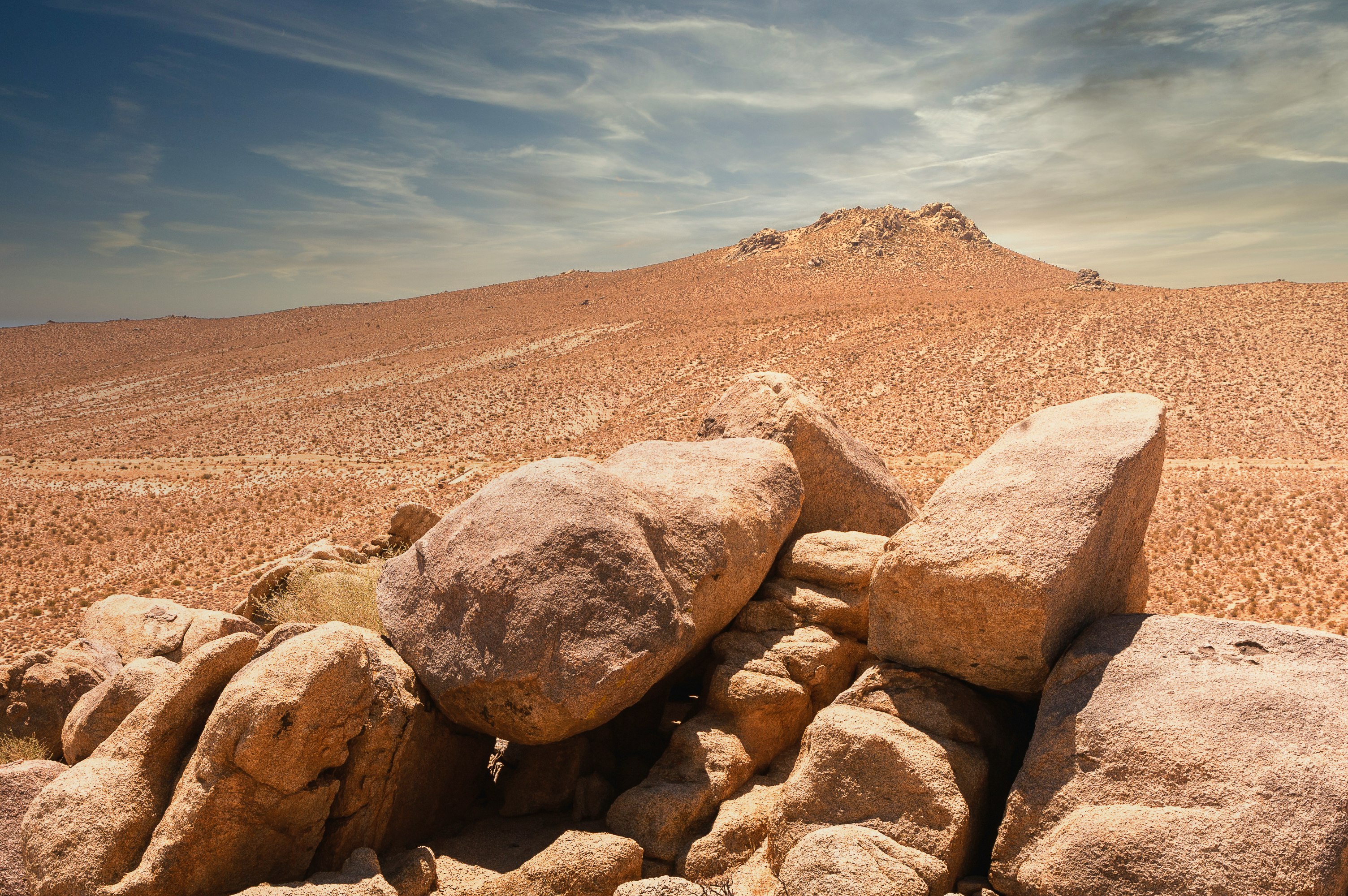 brown rocky mountain under blue sky during daytime