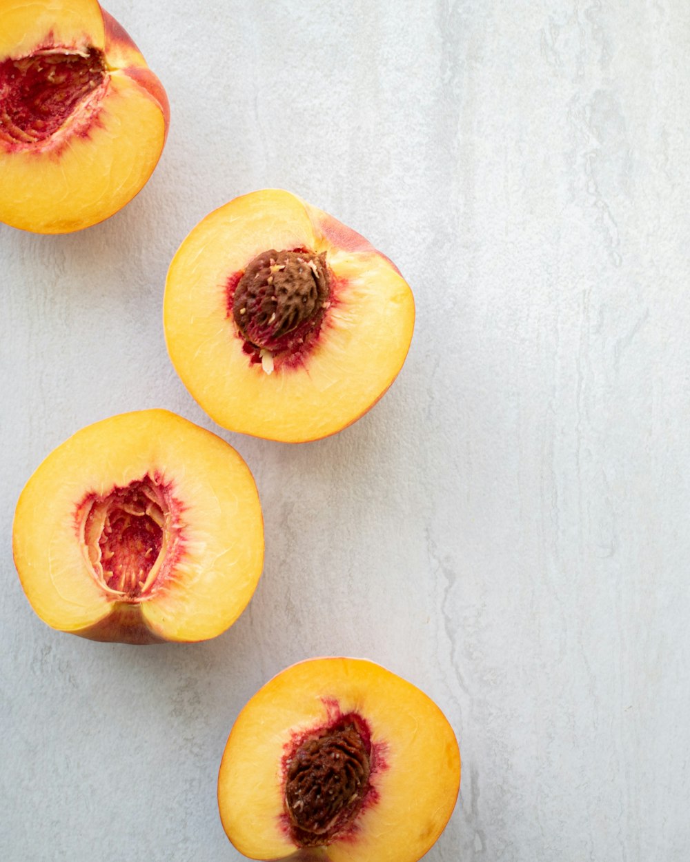 sliced red and yellow fruit