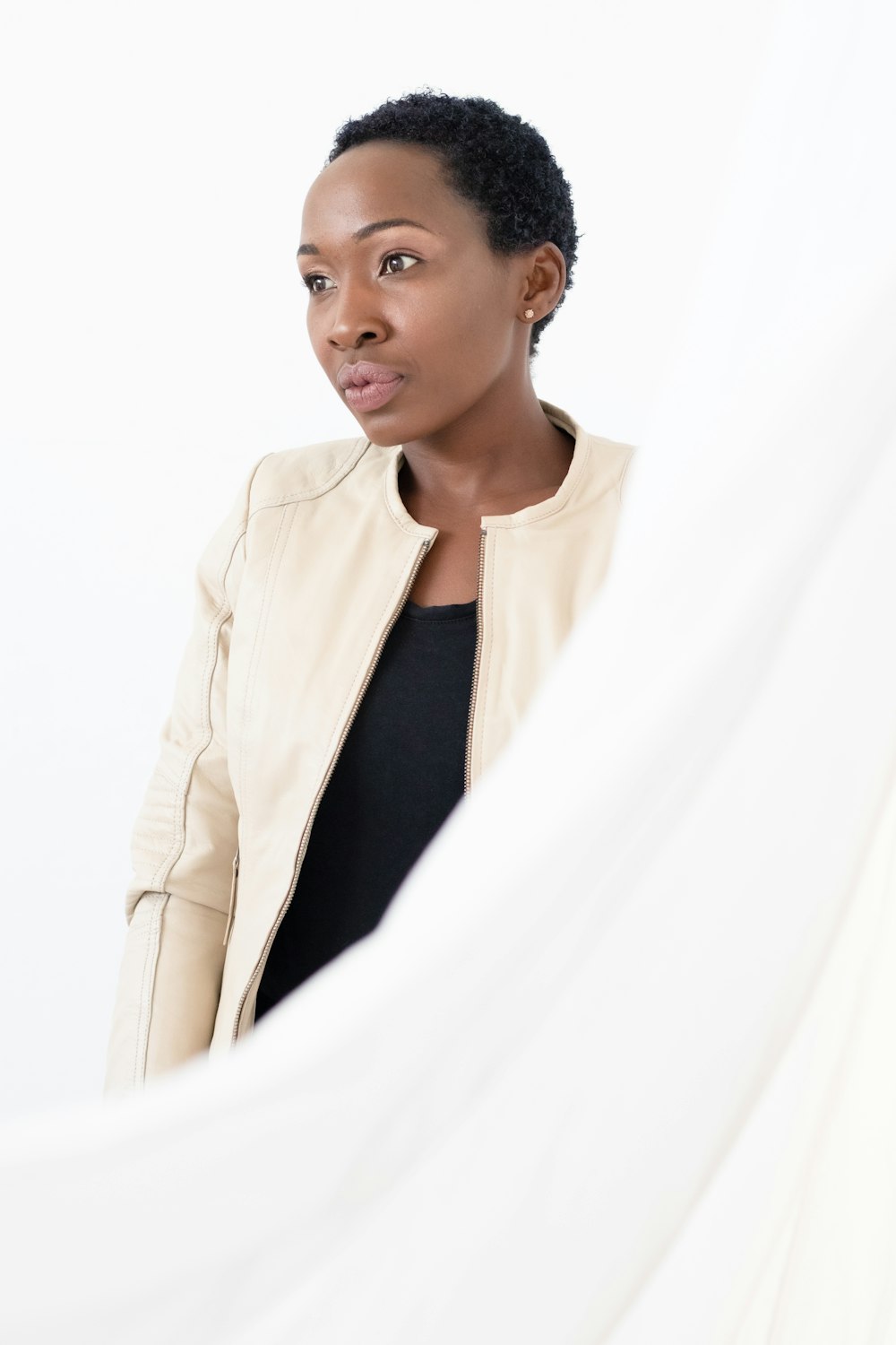 woman in white blazer and black shirt