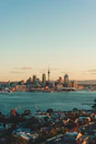 city skyline across body of water during daytime