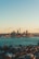 city skyline across body of water during daytime