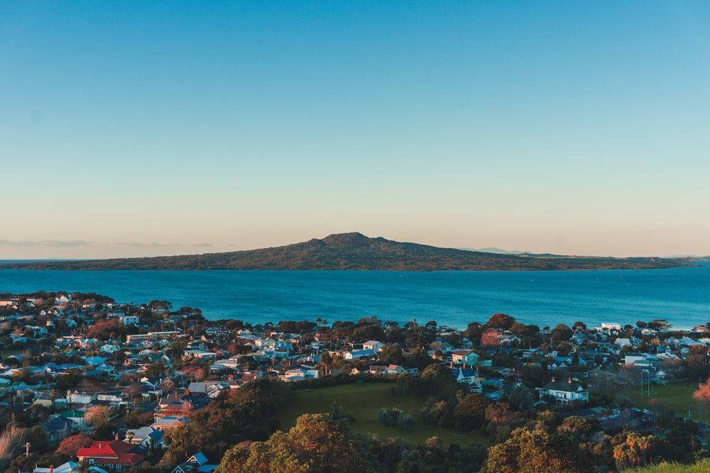 aerial view of city near body of water during daytime