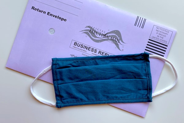 The impact of universal vote by mail and permanent absentee voting on turnout in 2020 and 2022