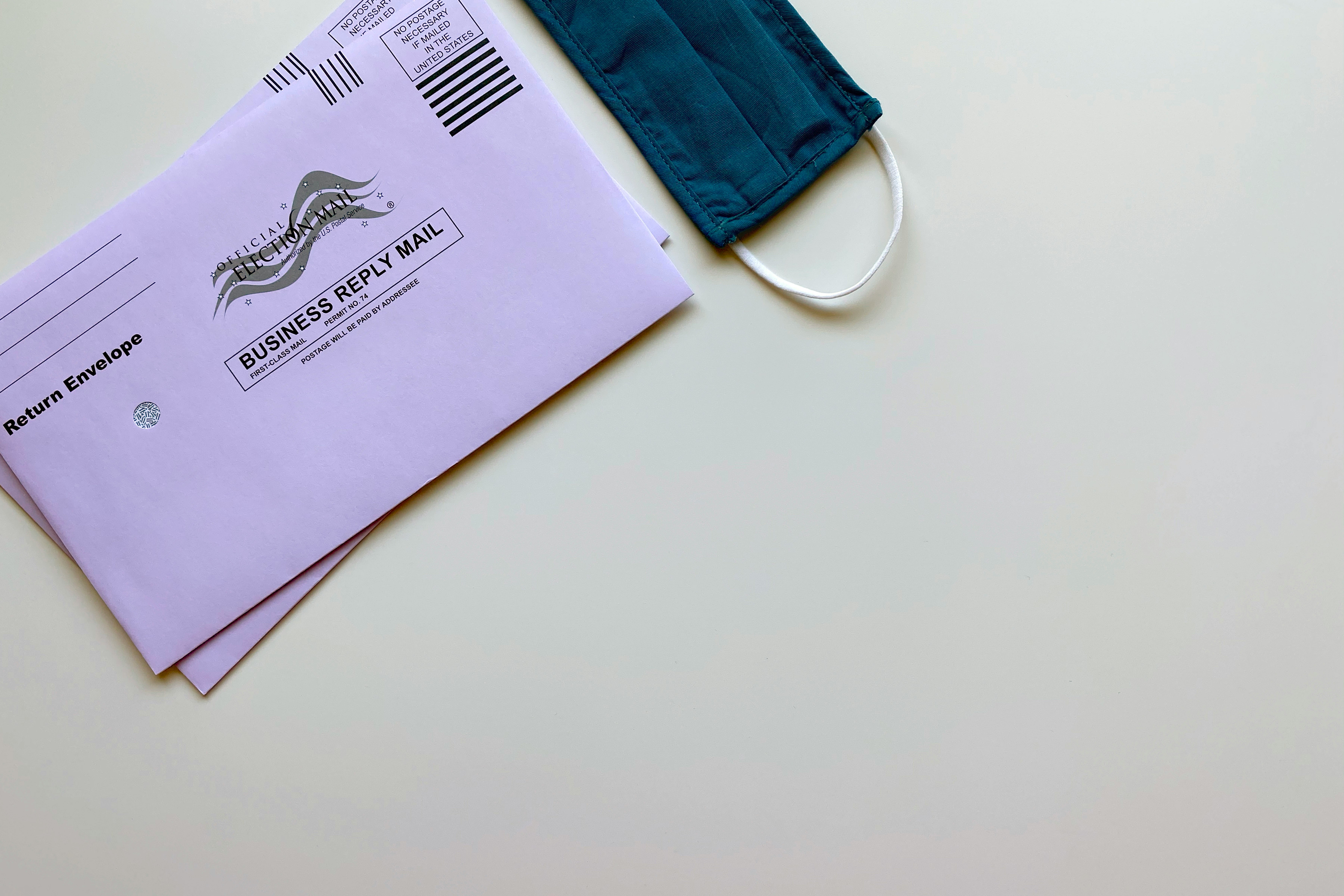 American election mail envelopes with face mask