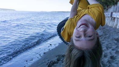 woman in yellow hijab on beach during daytime