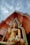 gold buddha statue under cloudy sky during daytime