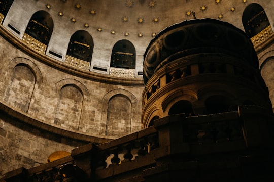 brown and gray concrete building in Church of the Holy Sepulchre Israel