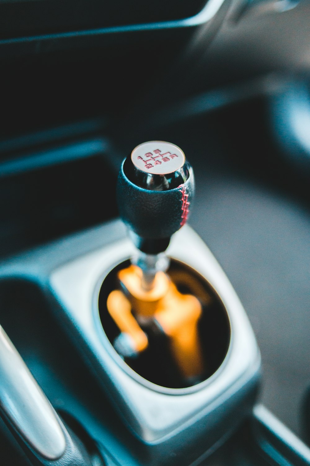 black and silver car gear shift lever