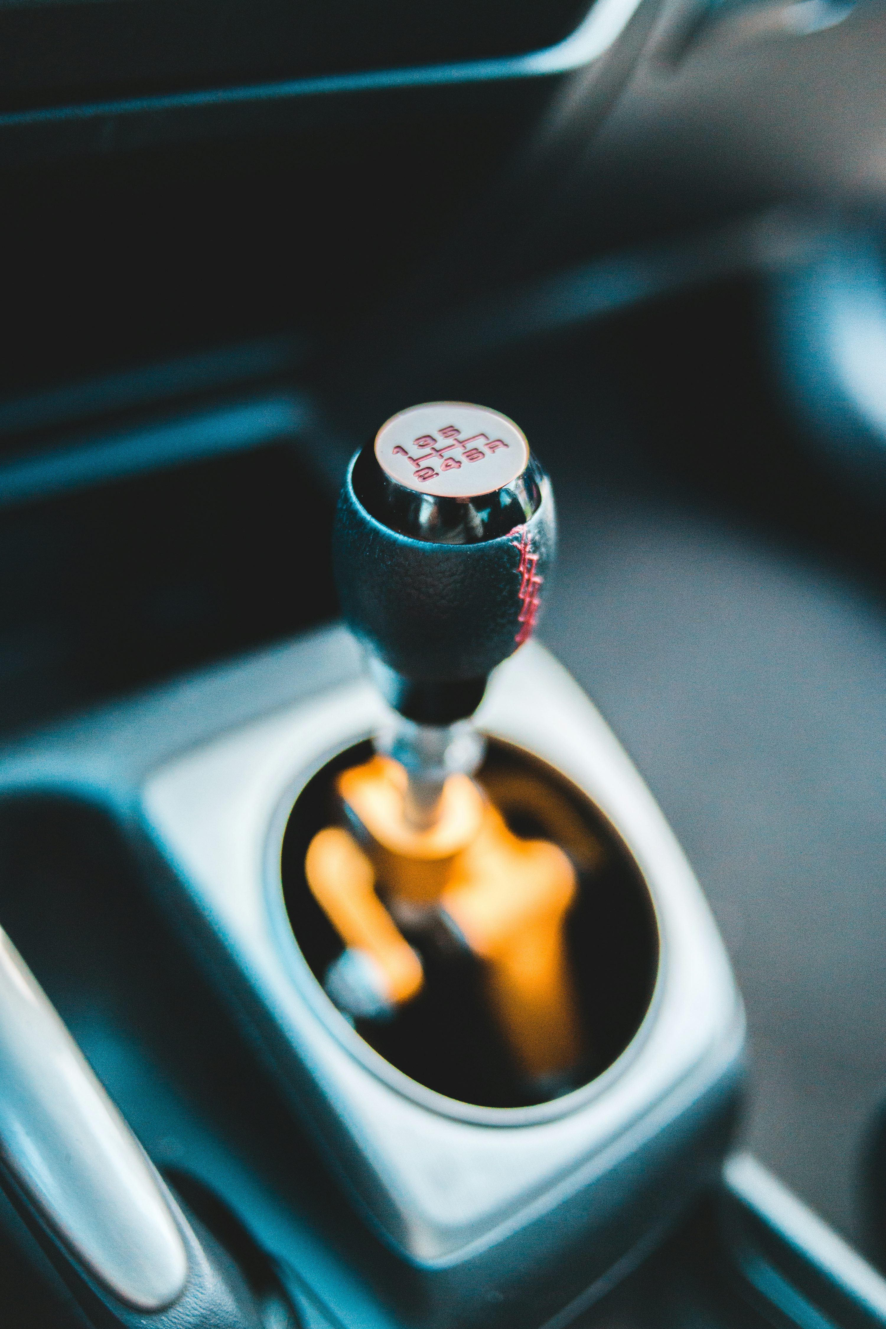 black and silver car gear shift lever